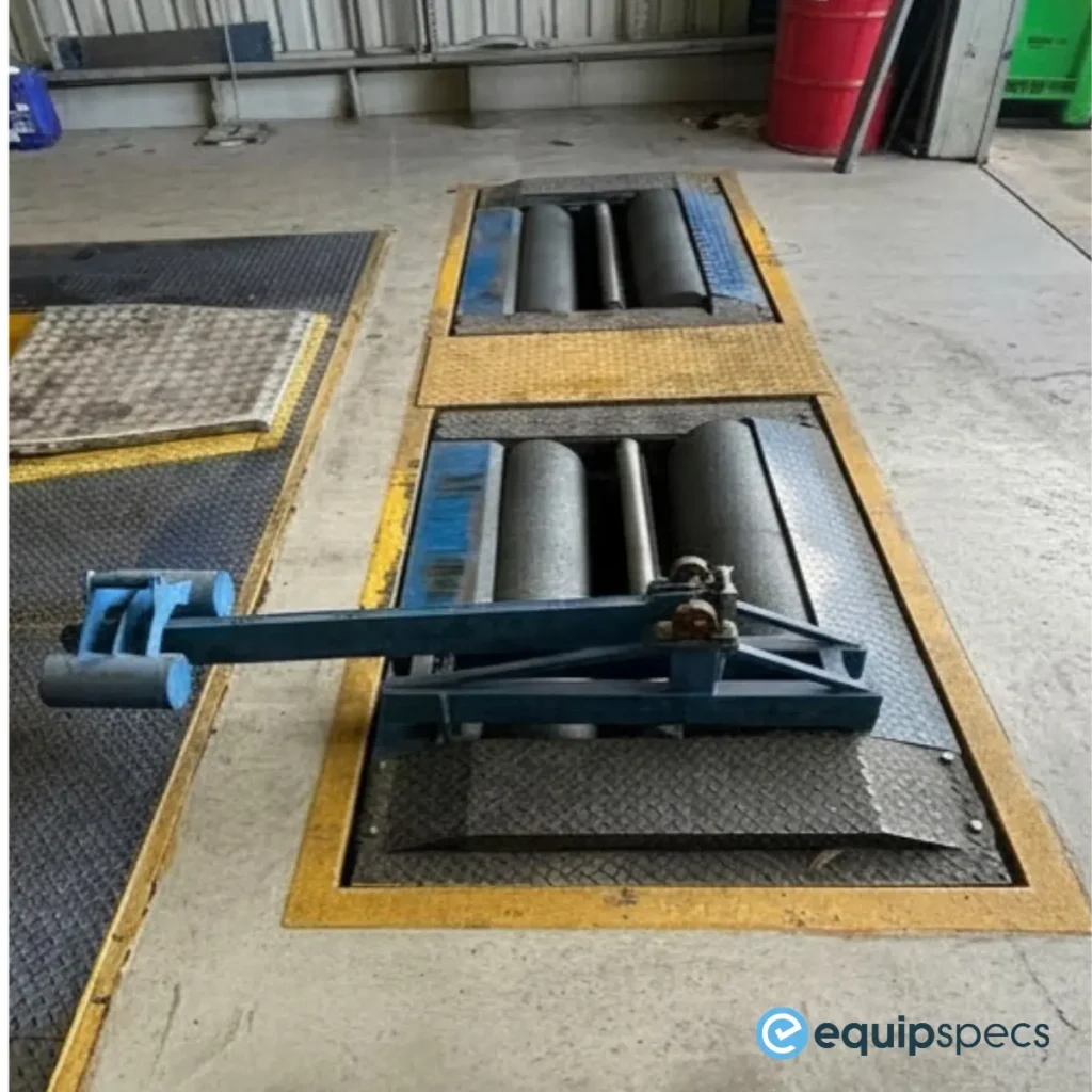 Truck roller brake tester undergoing calibration in an Australian heavy vehicle workshop using a calibrated force application device.